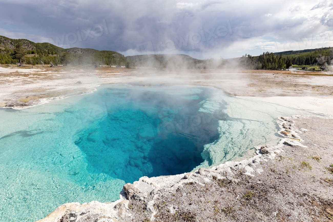 Steaming geothermal pool with mineral edges