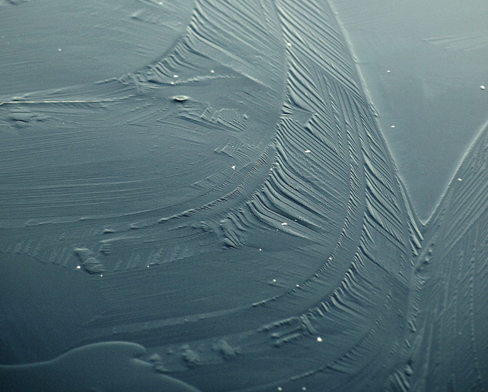 Cracked ice surface in flat winter light