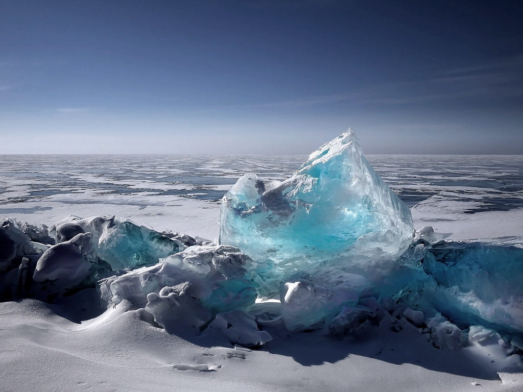 Blue ice standing in dark meltwater