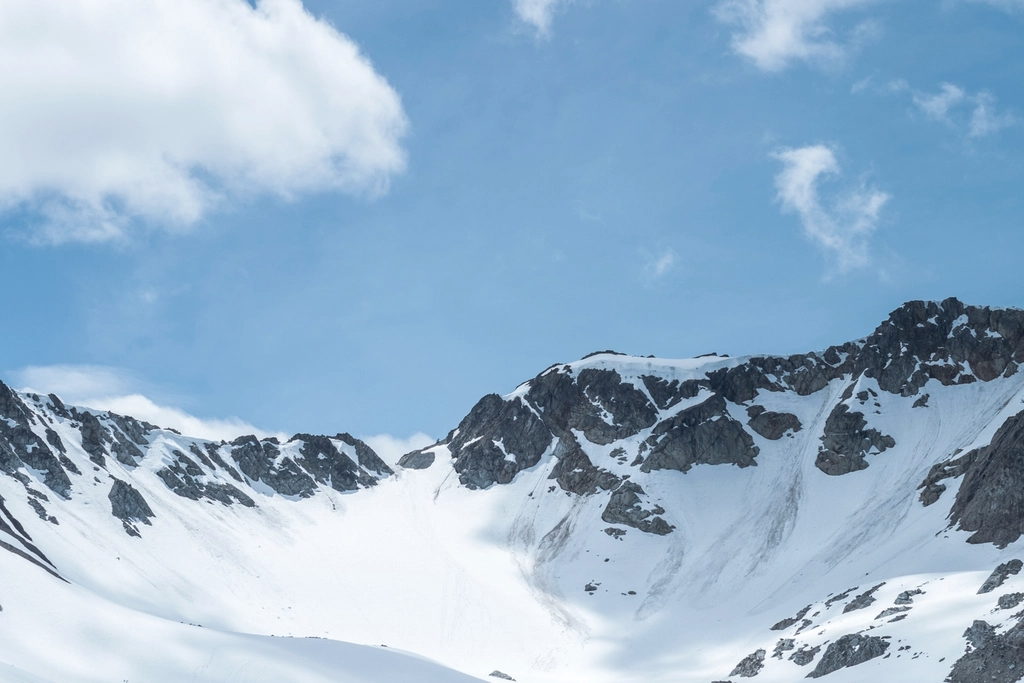 Snow-covered ridge line under a clear sky