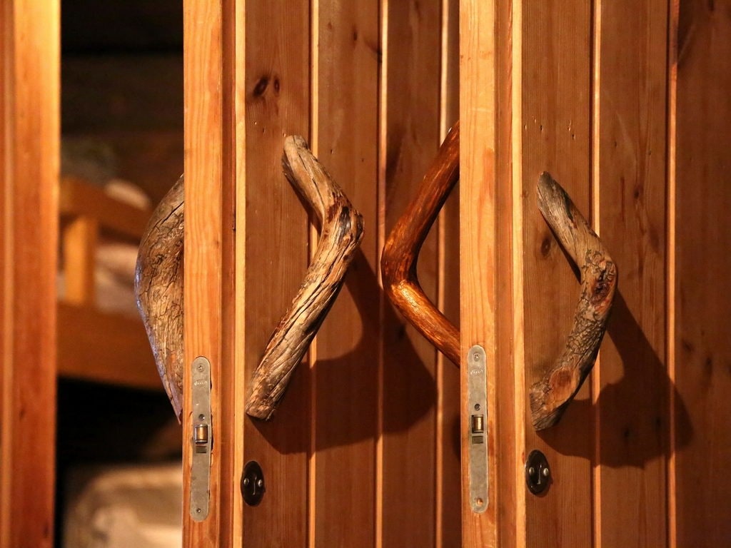 Timber sauna doors with turned wooden handles